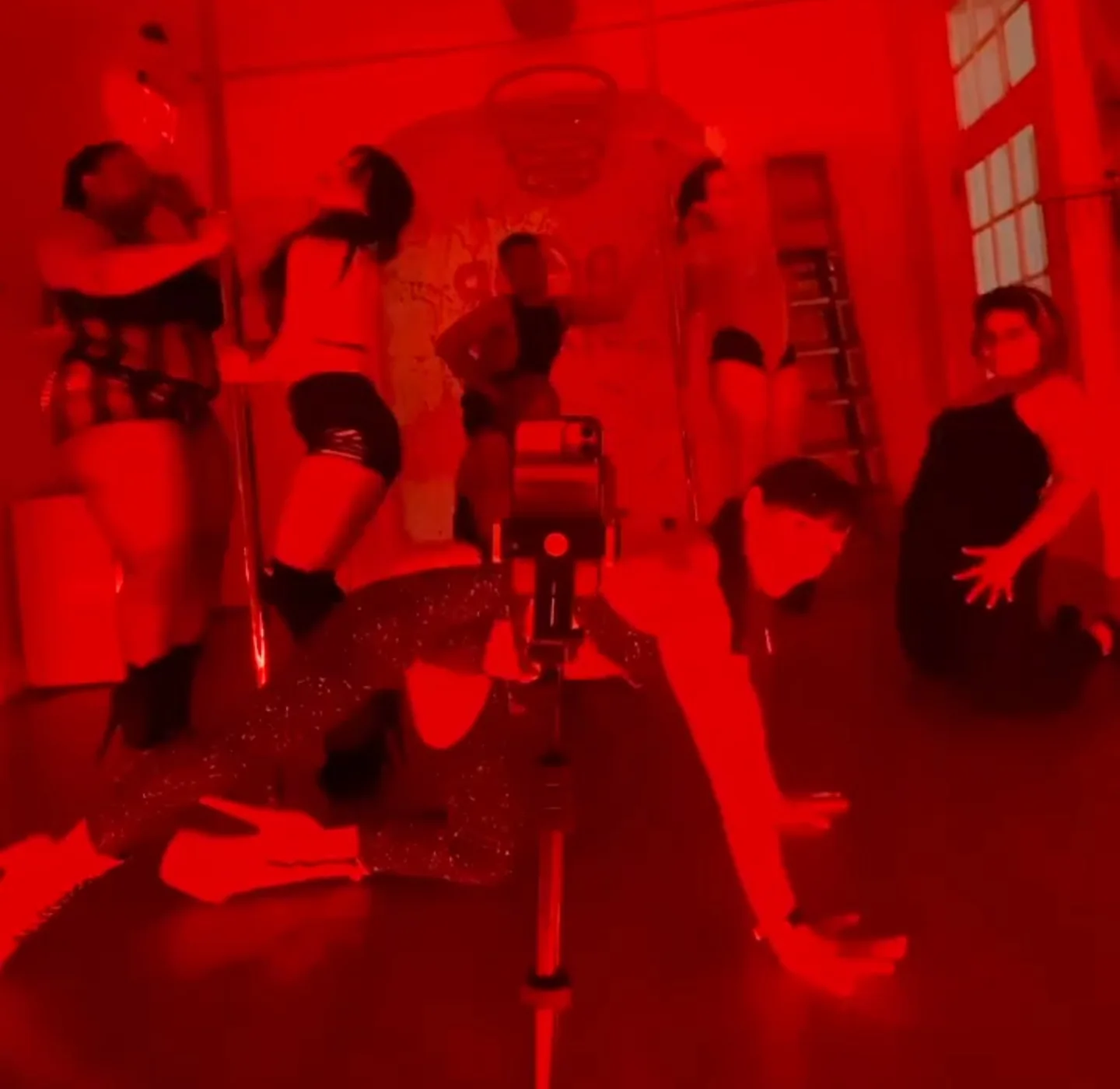 Instagram story from Polina Zueva's class at Pole to Pole Fitness in East Harlem, under red studio light.