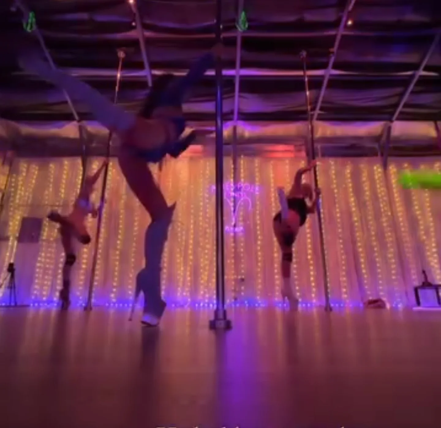 Instagram story from Polina Zueva's second class at Aries Pole Fitness, dancers inverted on the poles.